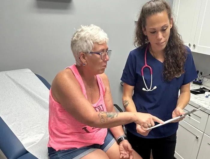 Provider reviewing test results with a senior patient